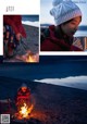 A woman sitting around a campfire with a cup of coffee.